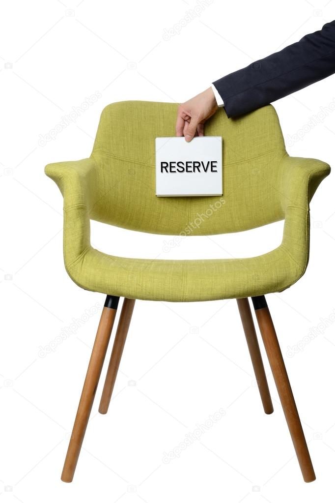 businessman hold paper note to reserve modern green armchair  wo