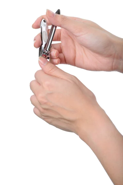 Manicure mão mulher com cortador de unhas isolado no branco — Fotografia de Stock