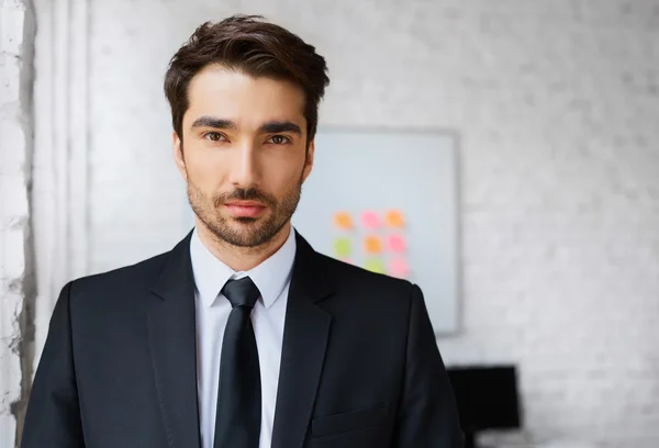 Business man standing in office — Stock Photo, Image