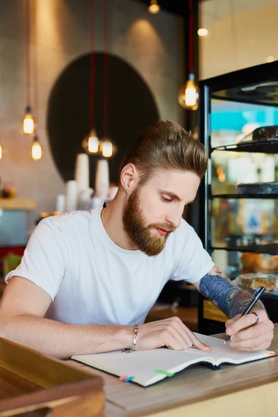 Restaurant owner counting expenses — Stock Photo, Image