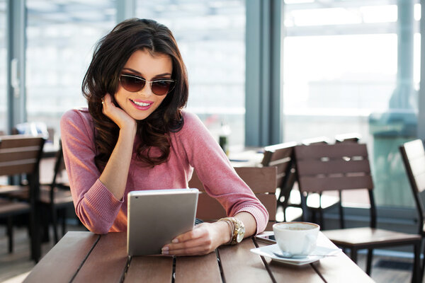 Woman surfing on her tablet