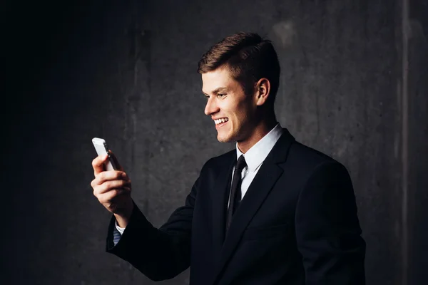 Businessman looking at smartphone — Stock Photo, Image