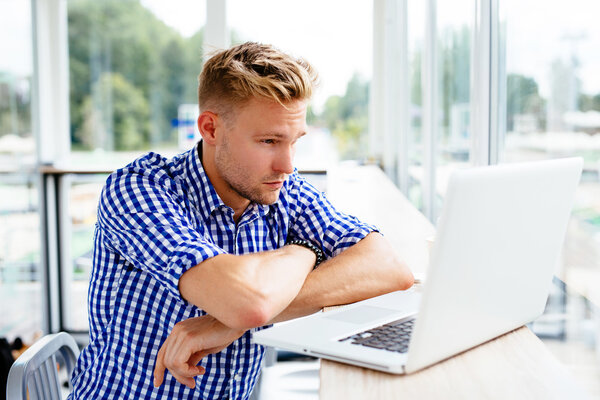 Man reading information on a laptop