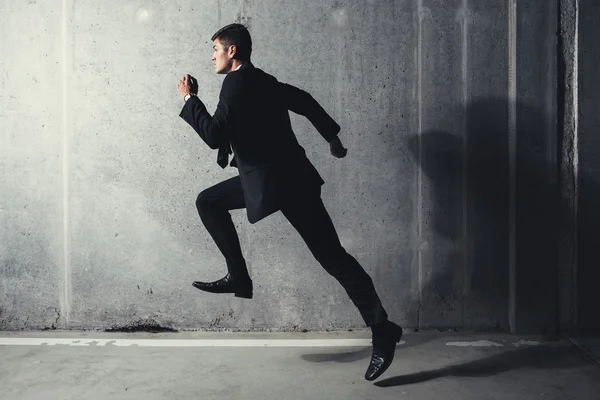 Running professional in a suit Royalty Free Stock Images