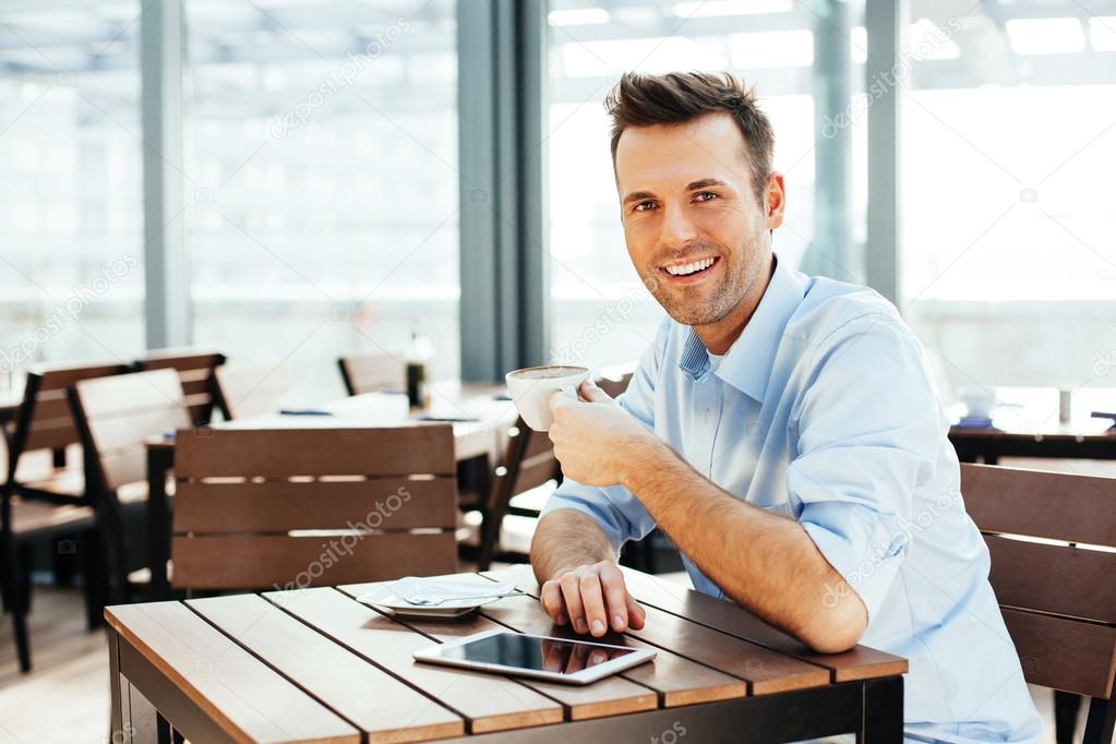 Handsome man with a cup of coffee