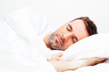 Handsome young man sleeping clipart