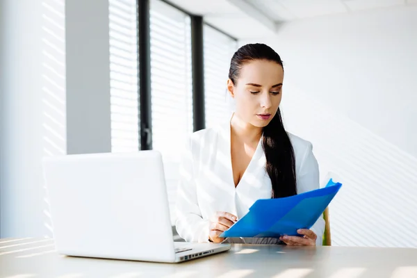 Woman professional looking at some files — Stock Photo, Image