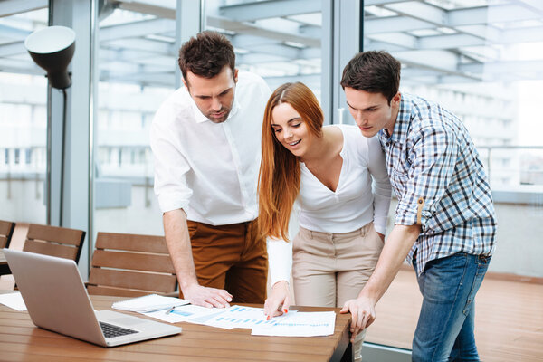 Business people discuss financial data