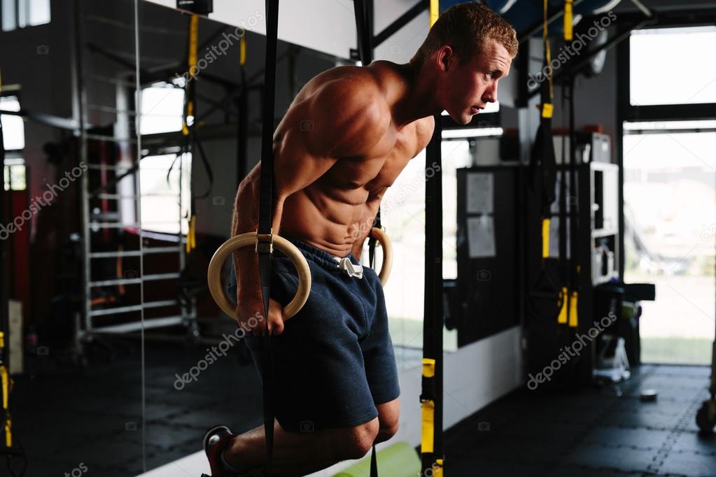 Man working out on gymnastic rings