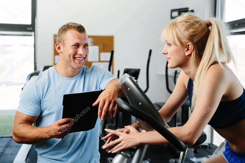 Woman talking with personal trainer