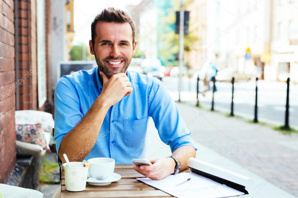 Young man at outdoor cafe