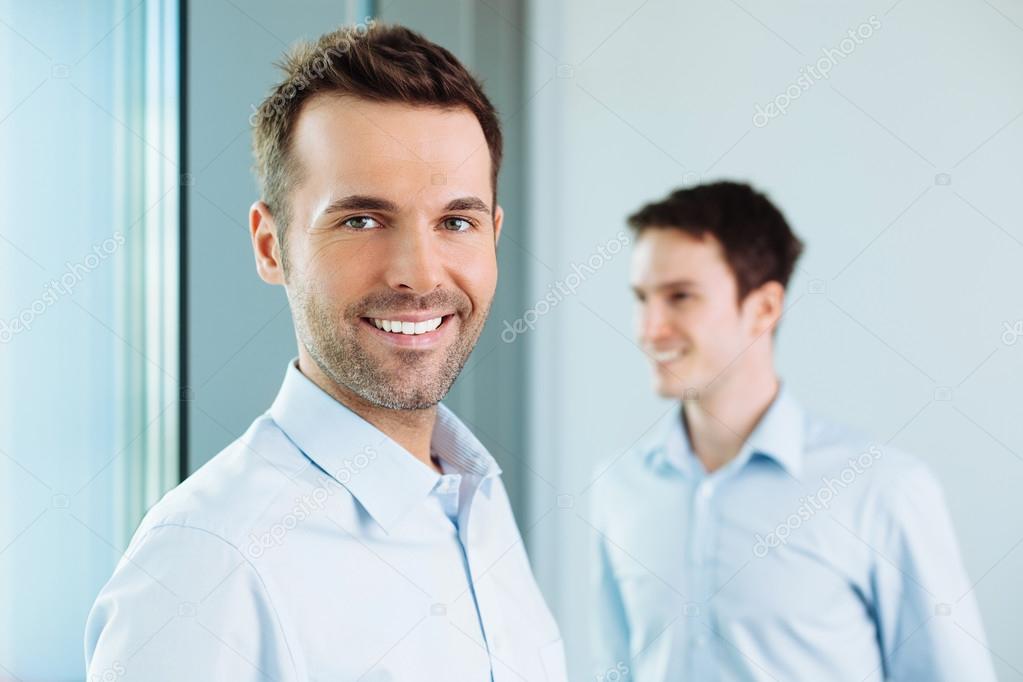 Business partners standing in office