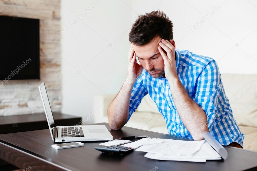 Man calculating his home bills
