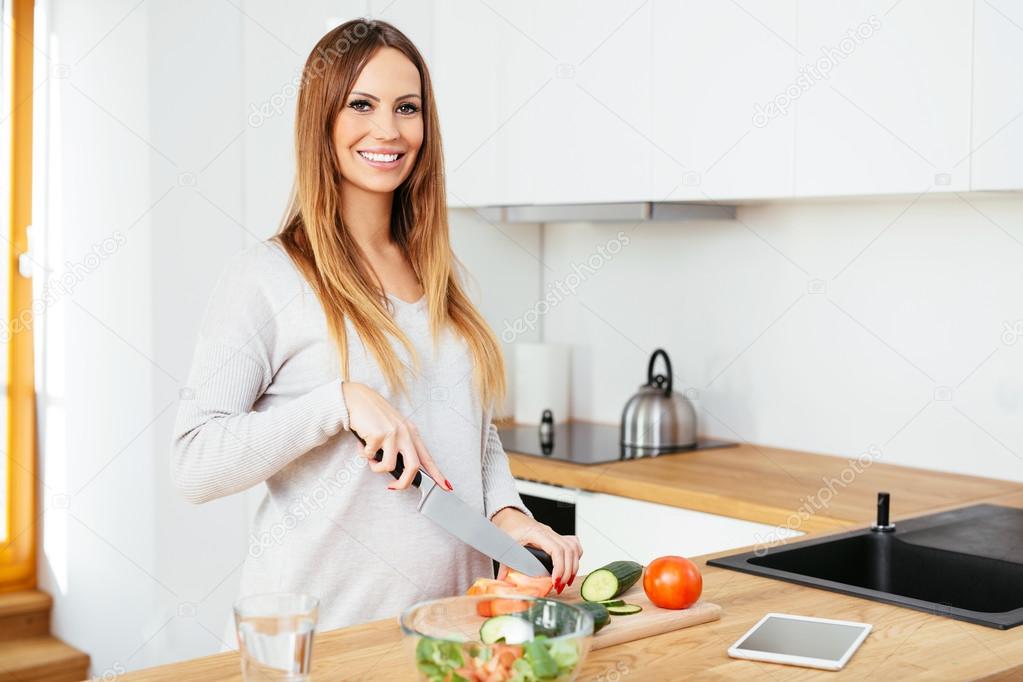 Pregnant woman cooking food