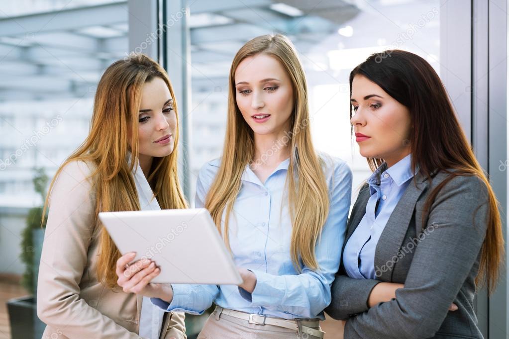 Businesswomen looking at a digital tablet