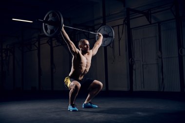 Muscular man training clipart