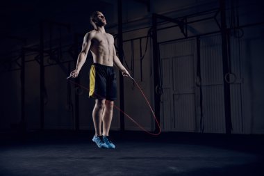 male athlete skipping rope clipart