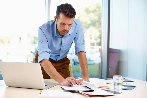 Busy businessman working at office — Stock Photo, Image