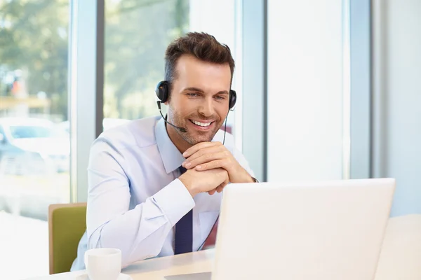 Happy businessman with headset — Stock Photo, Image