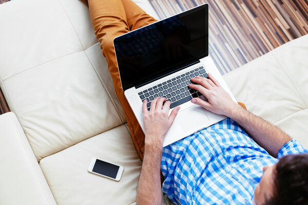 Young man relaxing on a sofa