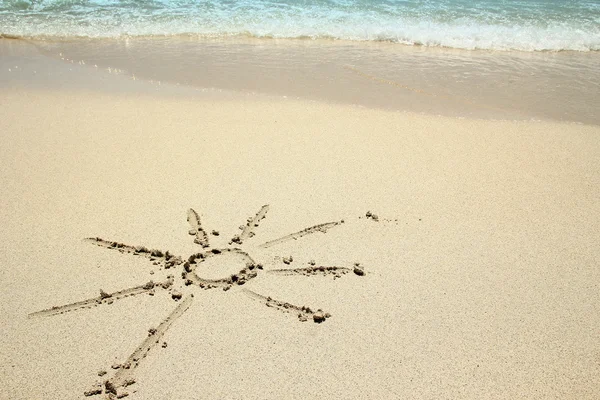 Sun sign on sand — Stock Photo, Image