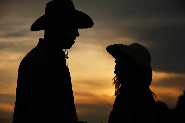 Young couple in cowboy hats — Stock Photo, Image