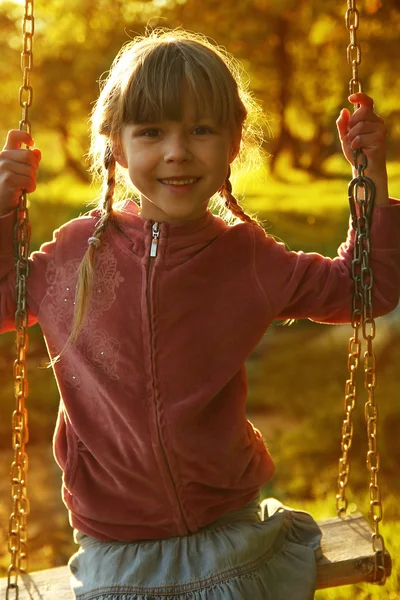 Girl on swing boat — Stock Photo, Image