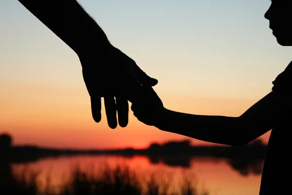 Parent holds small child — Stock Photo, Image