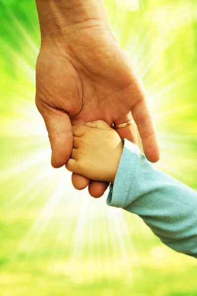 Parent holding child's hand — Stock Photo, Image