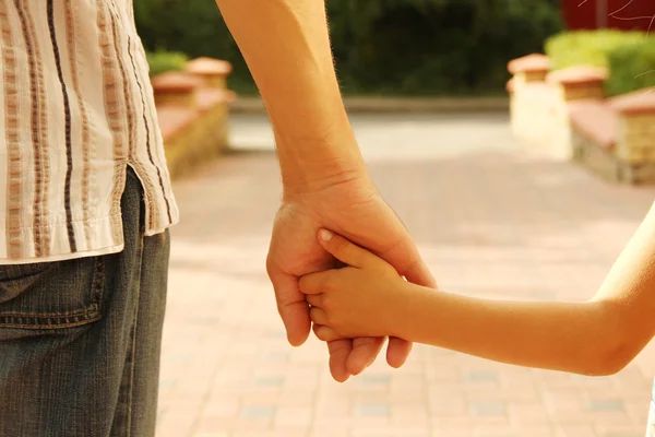 Parent holds hand of a child — Stock Photo, Image