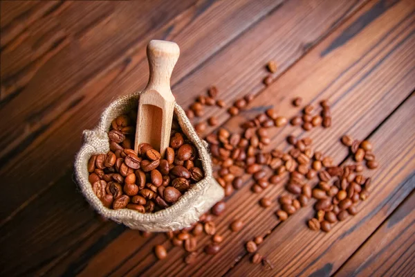 Una Bolsa Café Sobre Fondo Madera —  Fotos de Stock