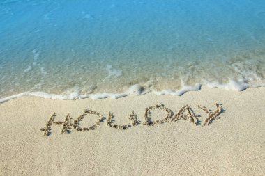 Deniz kıyısının kumlarında güzel çizimler