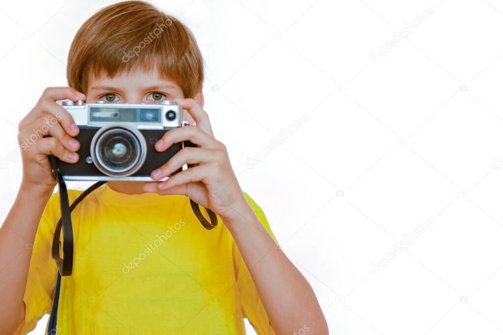 happy boy with a camera on the background