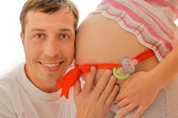 Man and pregnant female belly — Stock Photo, Image