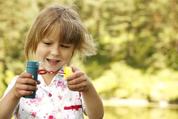 Little girl with soap bubbles — Stock Photo, Image