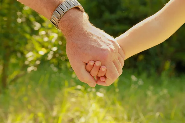 Abuelo con mano de niño — Foto de Stock