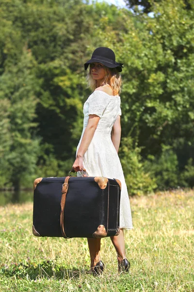 Young woman with suitcase — Stock Photo, Image