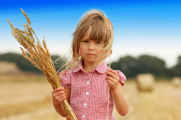 Girl with bunch of wheat — Stock Photo, Image