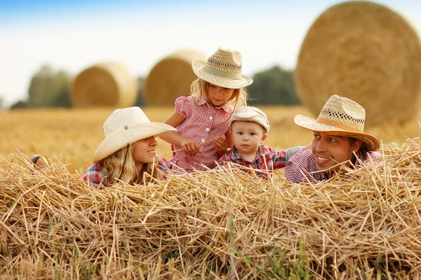 Young family in cowboy hats — Stock Photo, Image