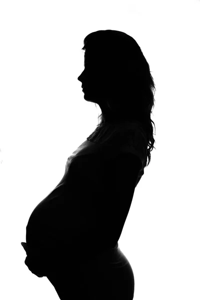 Silhouette of pregnant woman Royalty Free Stock Images