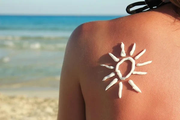 Sun shaped cream on back — Stock Photo, Image