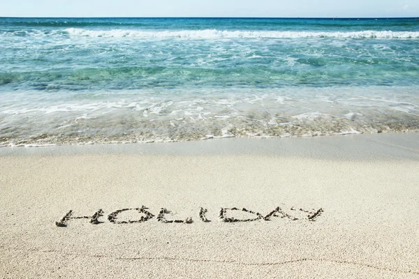 Inskriften holiday på sand — Stockfoto