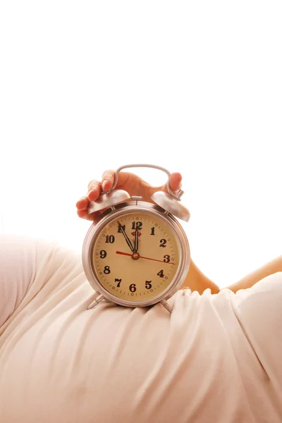 Donna incinta con una sveglia — Foto Stock