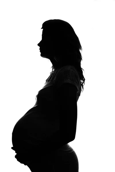 Silhouette of a pregnant woman Royalty Free Stock Photos