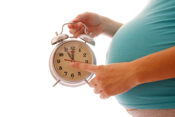 Kobieta w ciąży z budzikiem — Zdjęcie stockowe