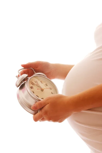 Pregnant woman with alarm clock — Stock Photo, Image