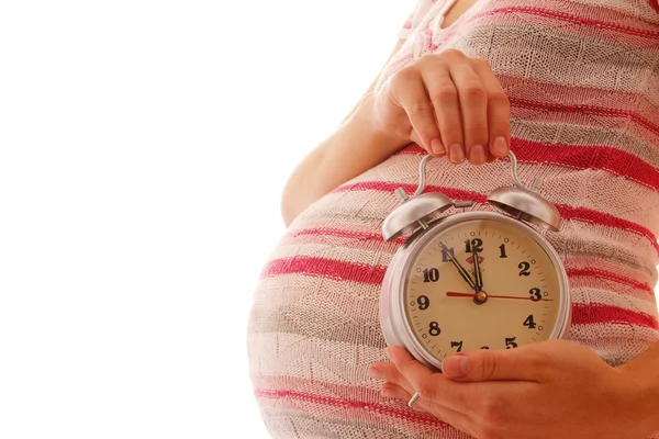 Mujer embarazada con despertador — Foto de Stock