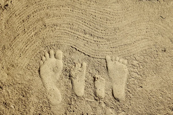 Menselijke voetstappen op zand — Stockfoto