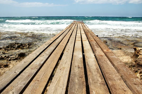 Bridge pier on the beach — Stock Photo, Image