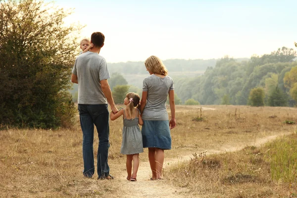 Young family on the nature — Stock Photo, Image